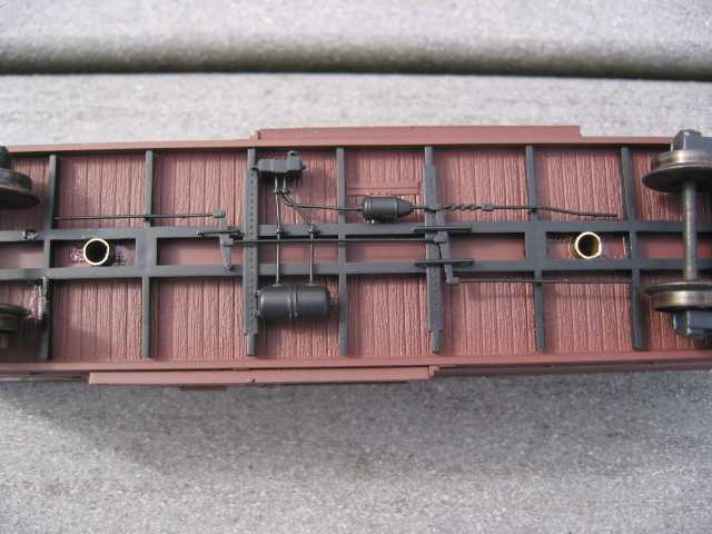 Underframe of car - note brass tubing that lines the holes